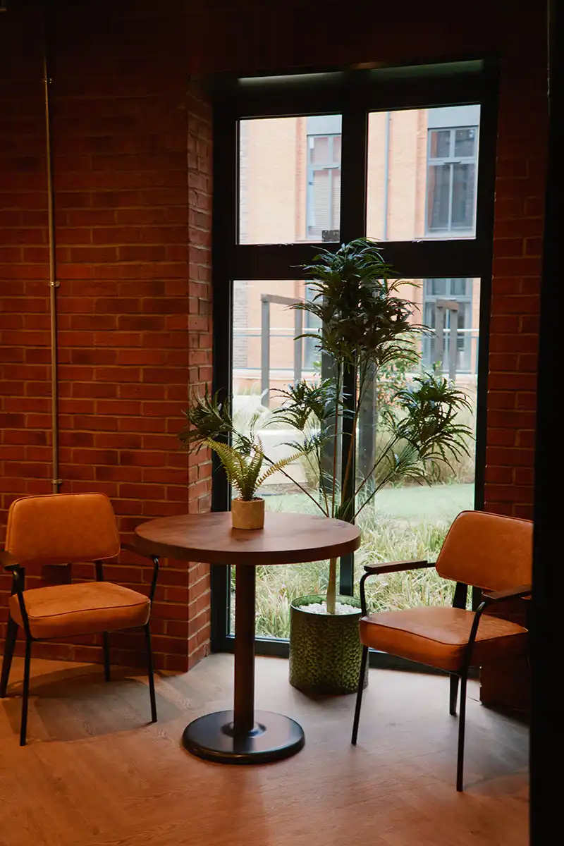 Two empty chairs at a table